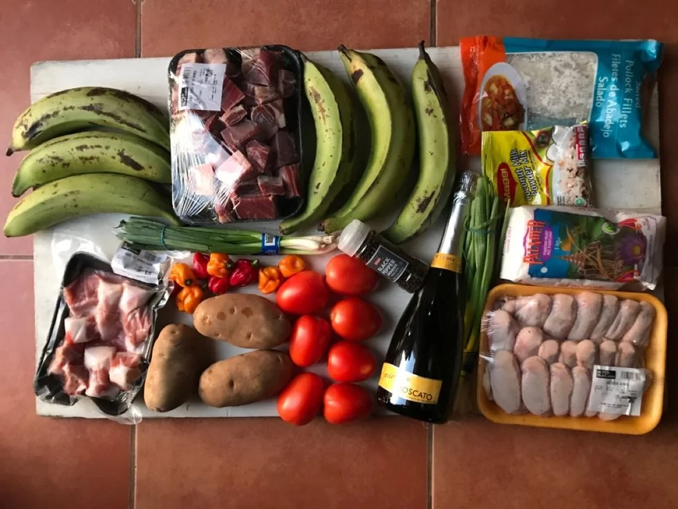 Weekly grocery haul of plantain, meat, tomatoes, potatoes and pantry items